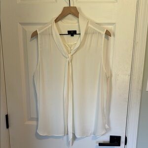 White Sleeveless Blouse with Tie Neck